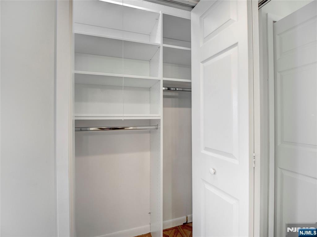 160 Overlook Avenue, Unit 17C Hackensack, NJ 07601 - Photo 7 of 30 a view of walk in closet with empty racks