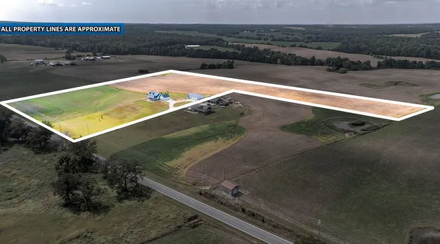 a living room with fireplace furniture and a flat screen tv