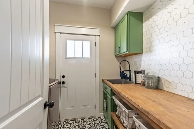 a bathroom with a double vanity sink mirror and shower