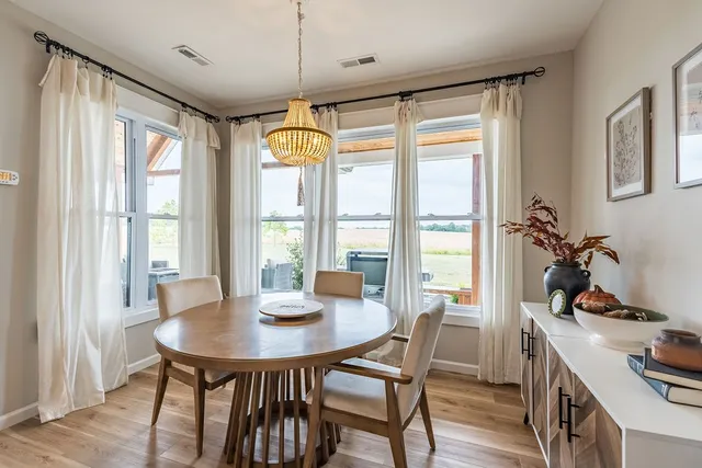 a bathroom with a tub and a window