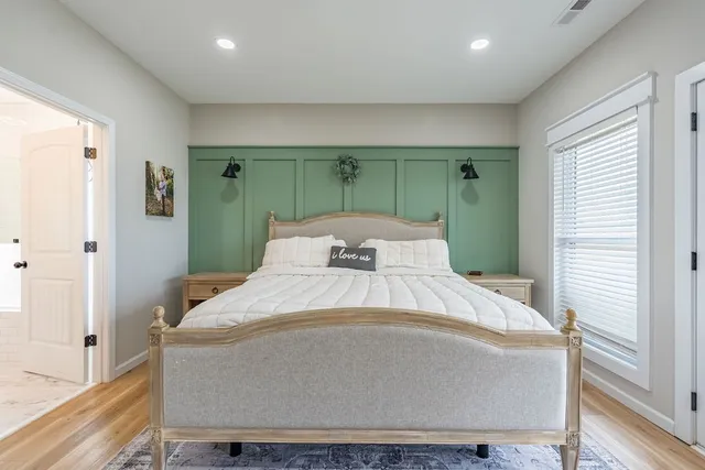 a house view with swimming pool in front of it