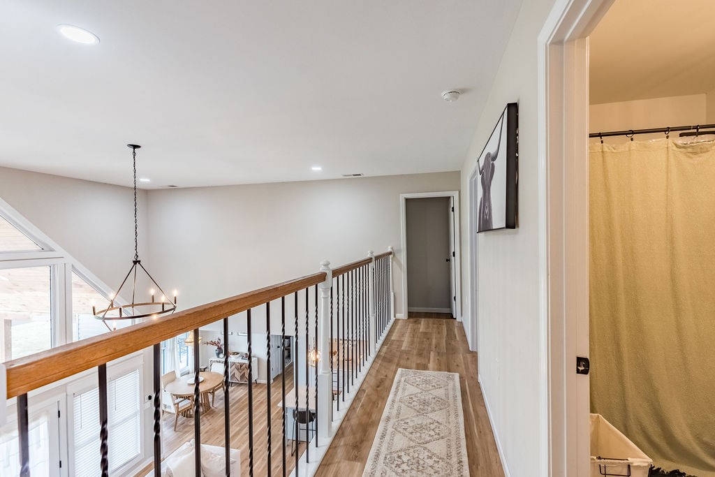 3765 S Road Cadiz, KY 42211 - Photo 43 of 78 a view of a hallway with wooden floor and staircase