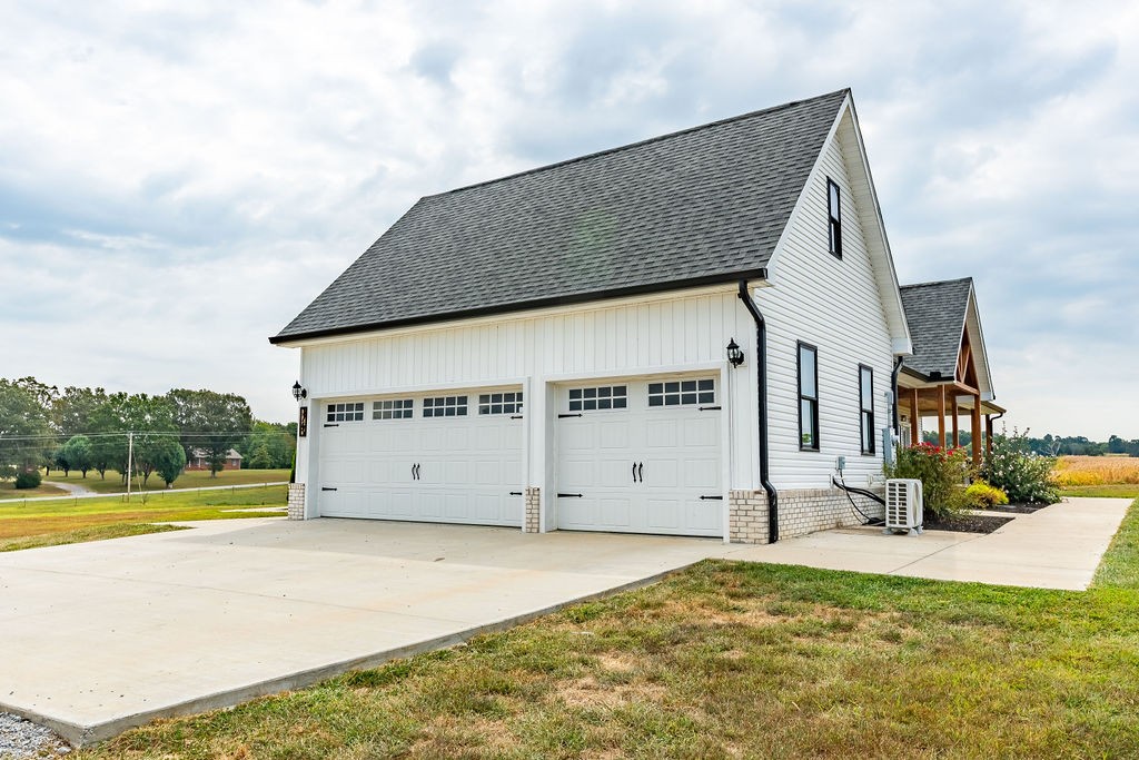3765 S Road Cadiz, KY 42211 - Photo 52 of 78 a view of a house with backyard and sitting area