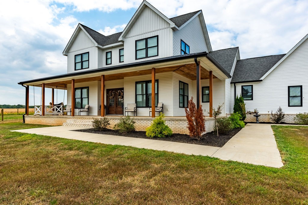 3765 S Road Cadiz, KY 42211 - Photo 57 of 78 a view of a house with swimming pool and porch