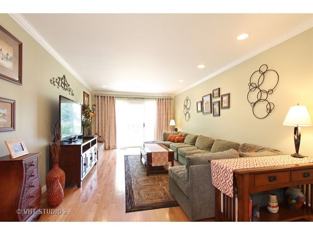 910 Dannet Road Buffalo Grove, IL 60089 - Photo 11 of 25 a living room with furniture and a large window
