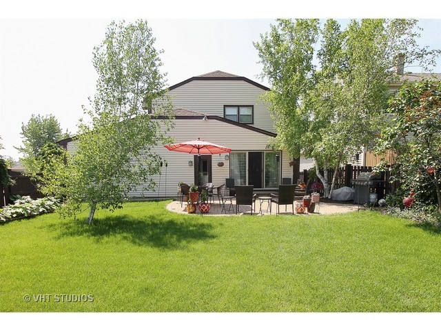 910 Dannet Road Buffalo Grove, IL 60089 - Photo 24 of 25 a view of a house with a yard and sitting area