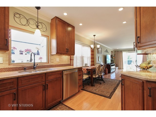 910 Dannet Road Buffalo Grove, IL 60089 - Photo 7 of 25 a living room with kitchen island granite countertop furniture a sink a window and stainless steel appliances