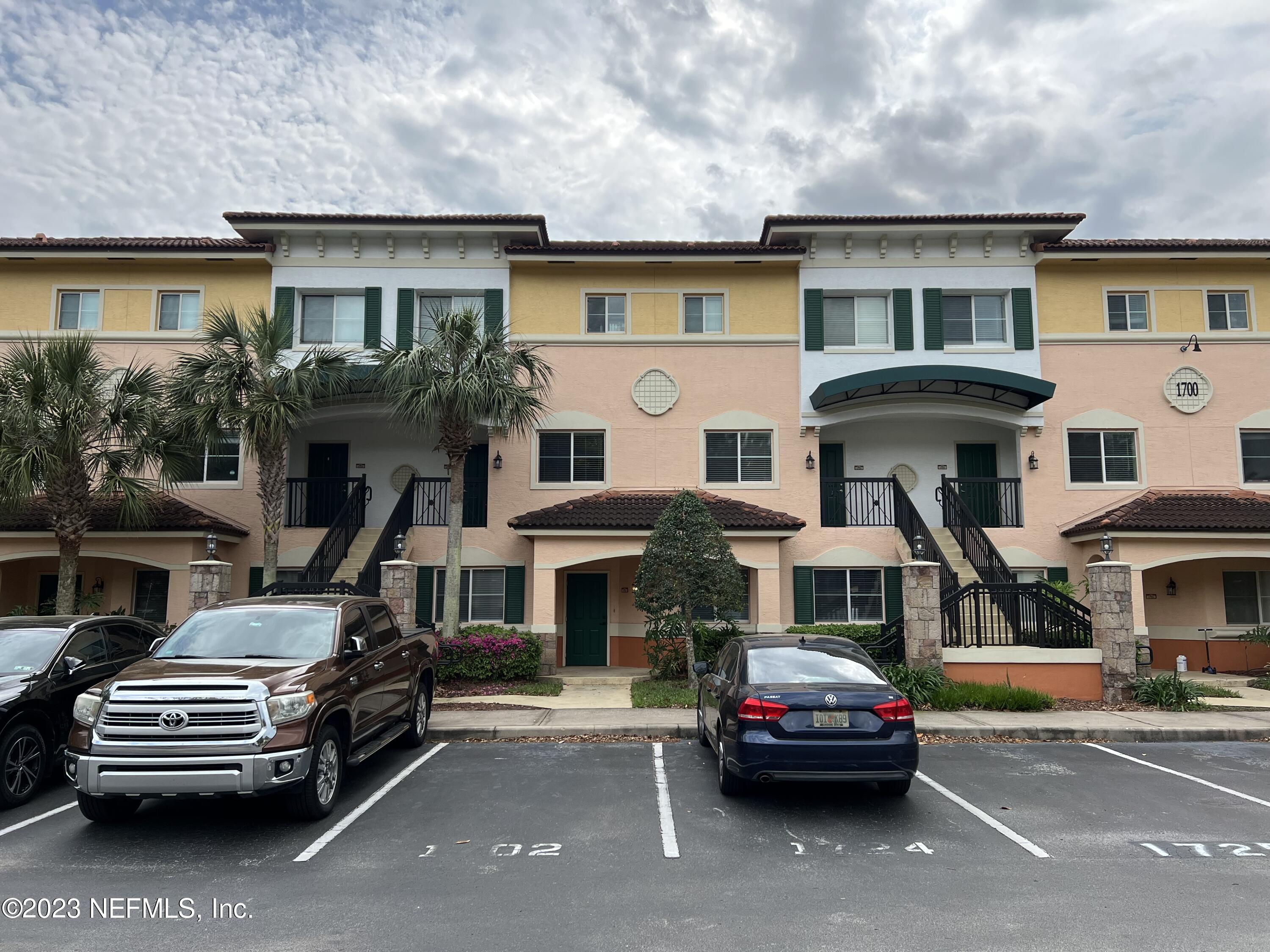 9745 Touchton Road, Unit 1702 Jacksonville, FL 32246 - Photo 2 of 62 a car parked in front of a white building