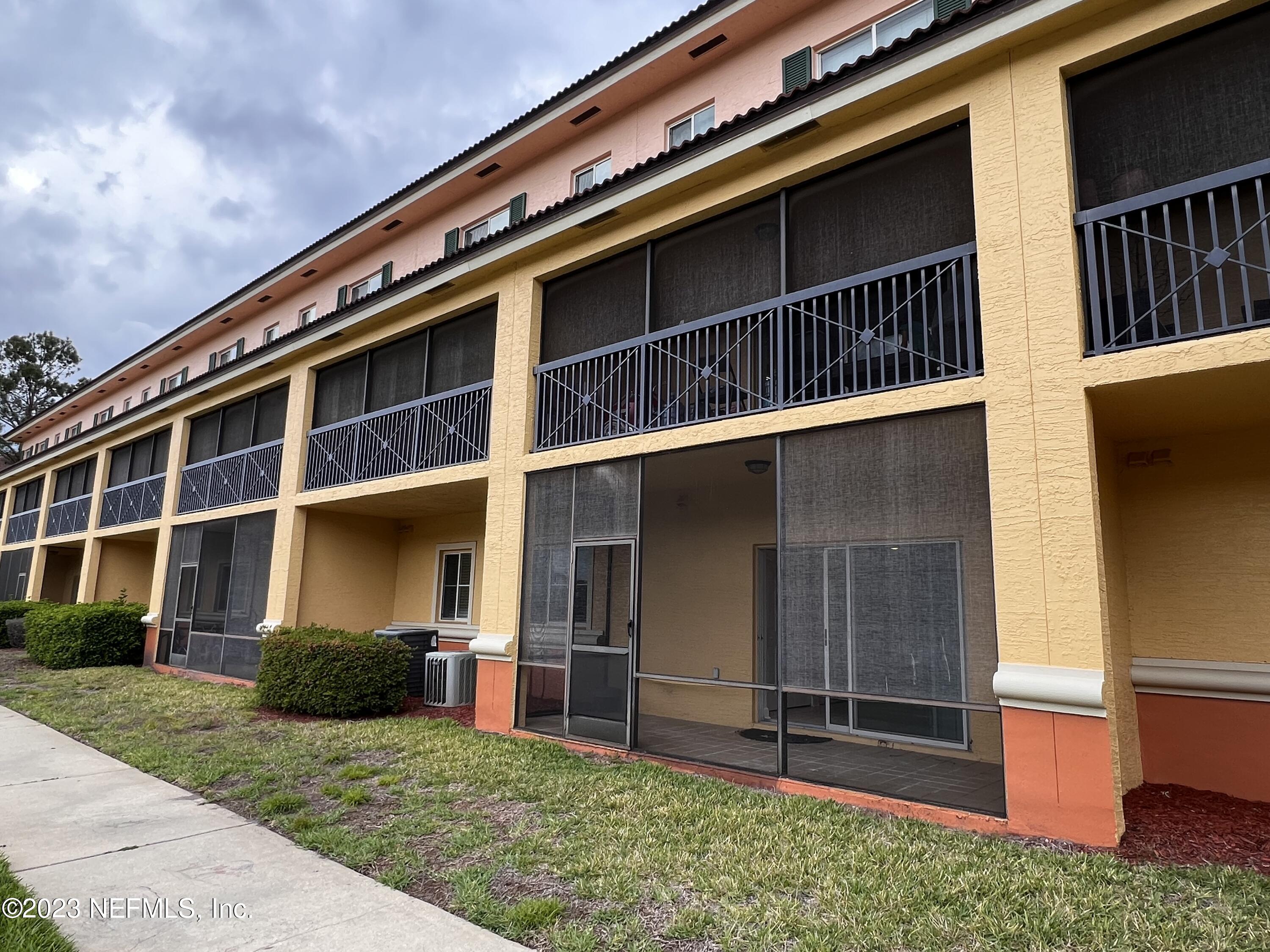 9745 Touchton Road, Unit 1702 Jacksonville, FL 32246 - Photo 21 of 62 a view of a house with a large window and stairs