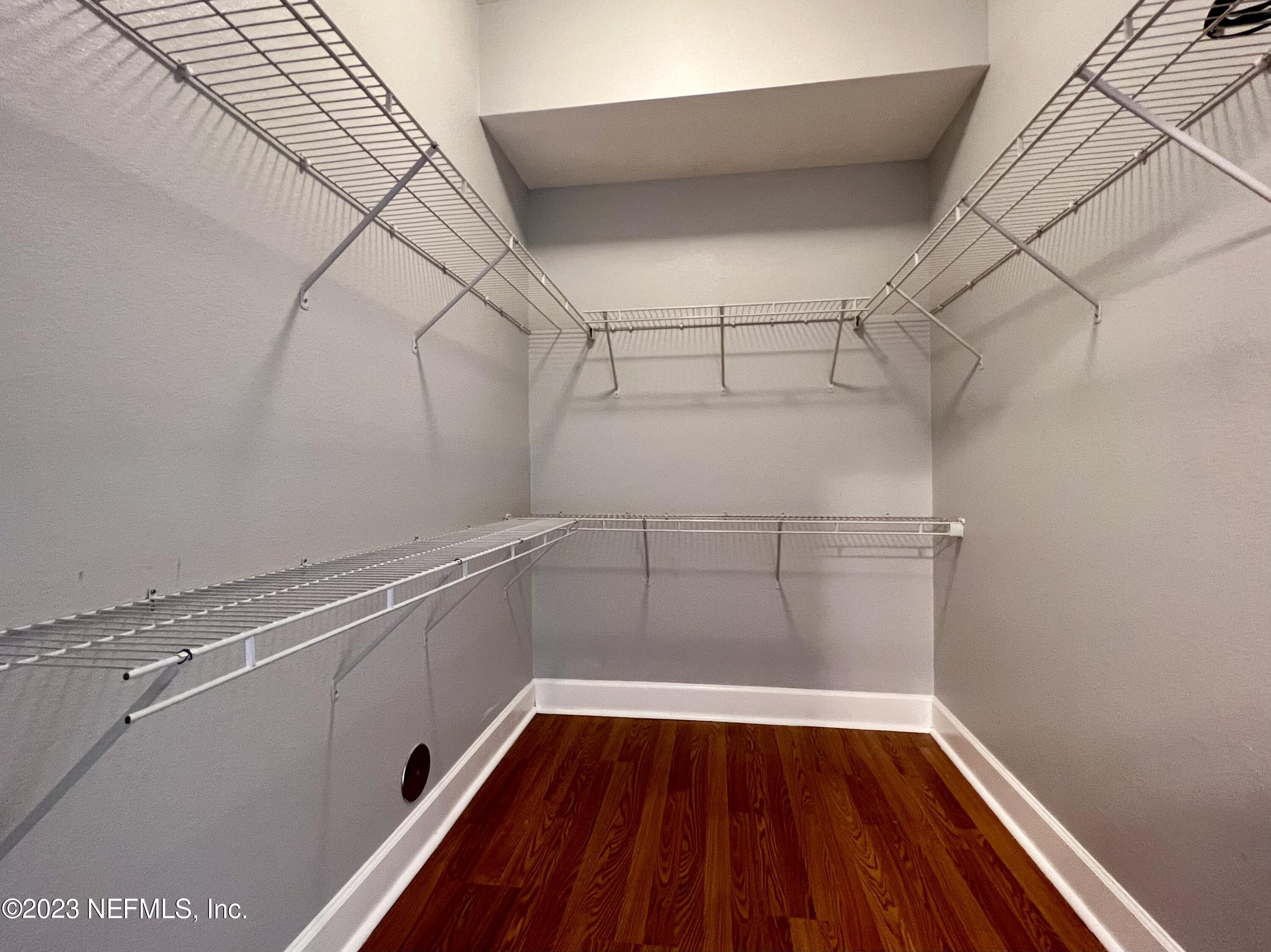 9745 Touchton Road, Unit 1702 Jacksonville, FL 32246 - Photo 27 of 62 a view of a room with racks on the wall