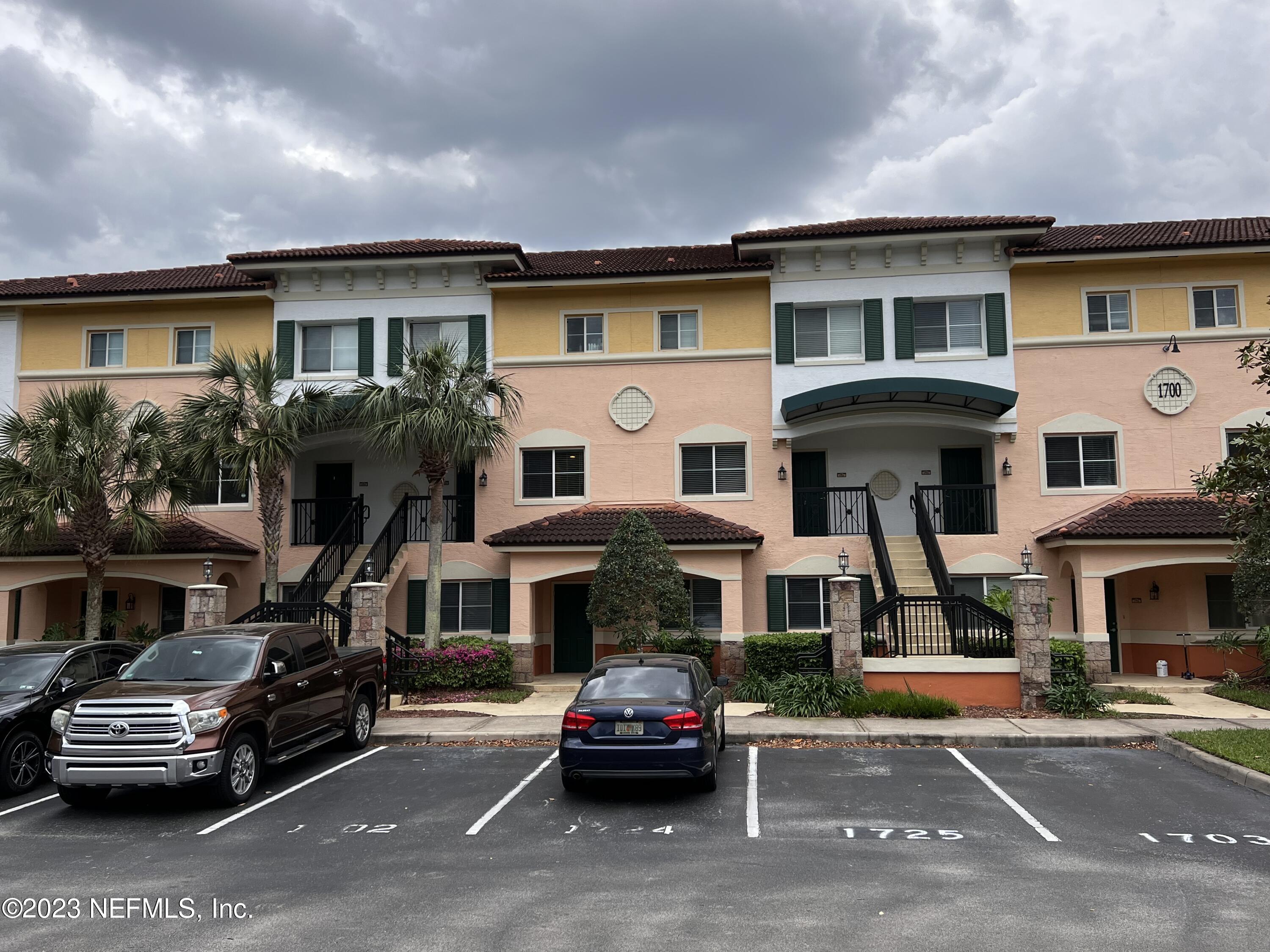 9745 Touchton Road, Unit 1702 Jacksonville, FL 32246 - Photo 38 of 62 a front view of a house with a parking space
