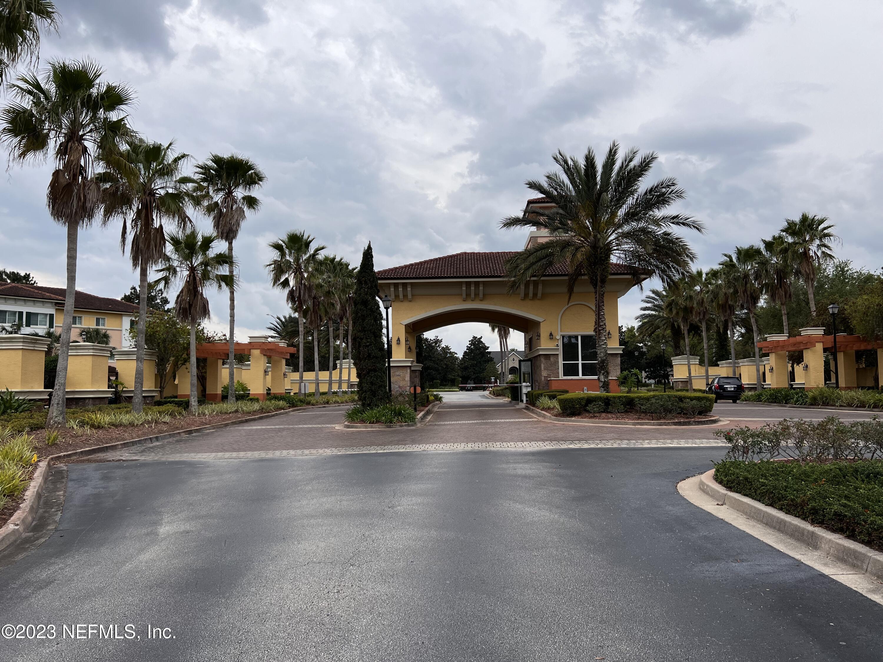 9745 Touchton Road, Unit 1702 Jacksonville, FL 32246 - Photo 44 of 62 a group of palm trees in front of a house