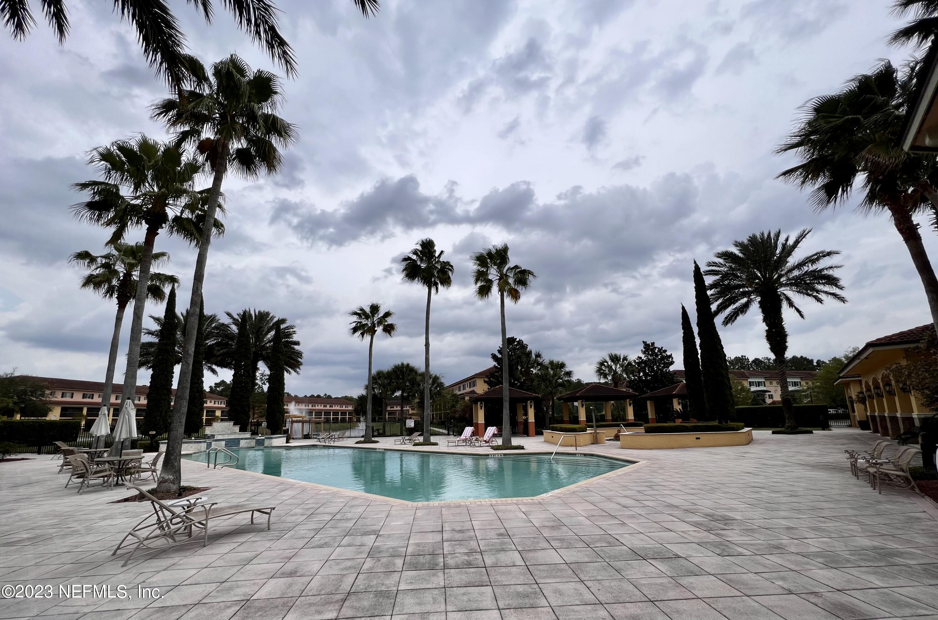 9745 Touchton Road, Unit 1702 Jacksonville, FL 32246 - Photo 48 of 62 a view of swimming pool with outdoor seating