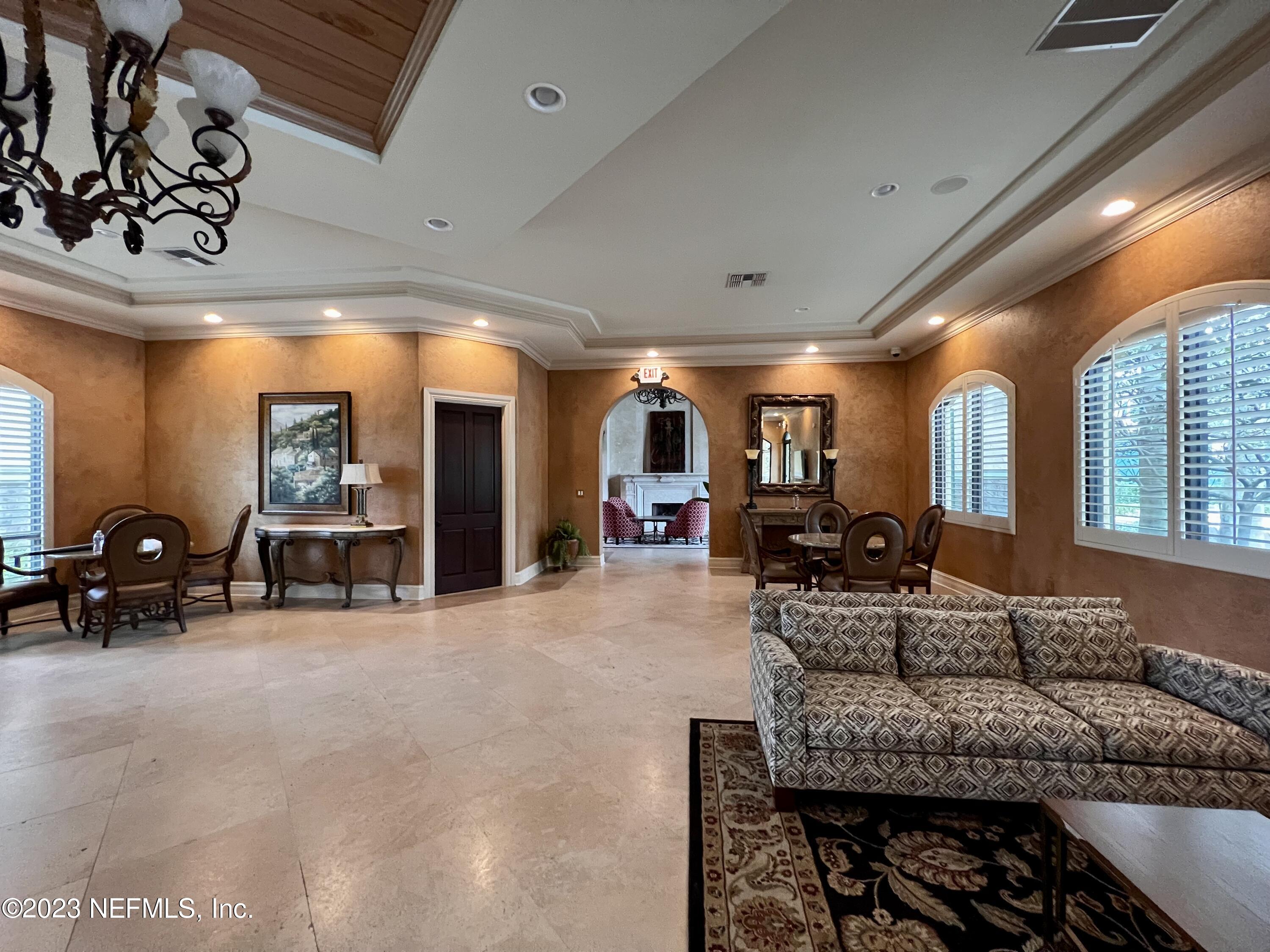 9745 Touchton Road, Unit 1702 Jacksonville, FL 32246 - Photo 57 of 62 a living room with furniture and a large window