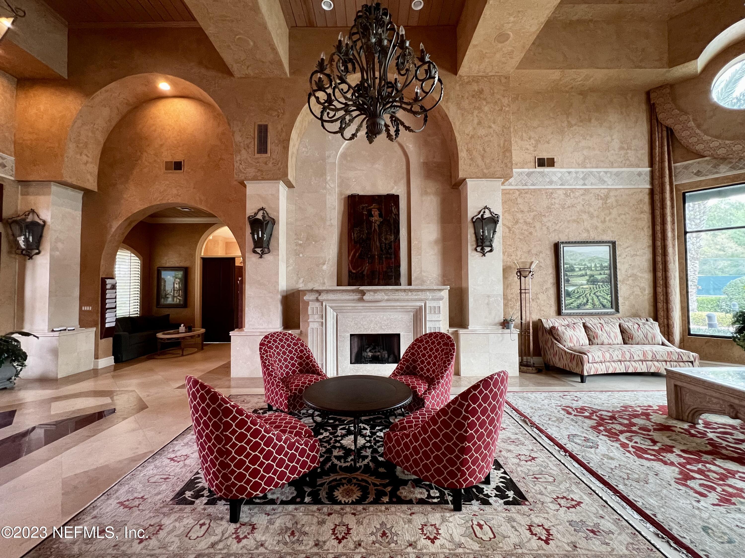 9745 Touchton Road, Unit 1702 Jacksonville, FL 32246 - Photo 60 of 62 a living room with furniture fireplace and rug
