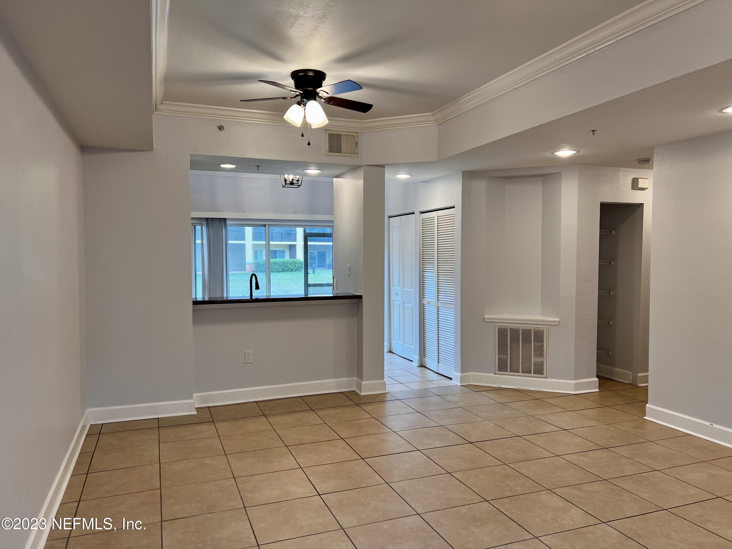 9745 Touchton Road, Unit 1702 Jacksonville, FL 32246 - Photo 7 of 62 a view of an empty room and window