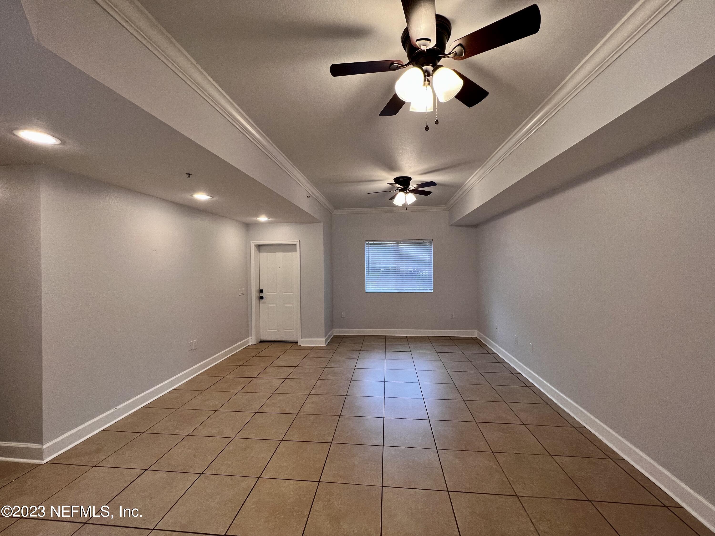 9745 Touchton Road, Unit 1702 Jacksonville, FL 32246 - Photo 9 of 62 a view of an empty room with a window