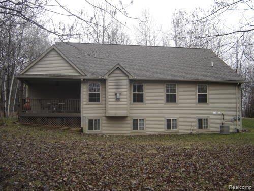 Back of house with covered porch