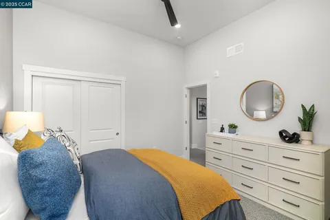 a bedroom with a bed and a dresser