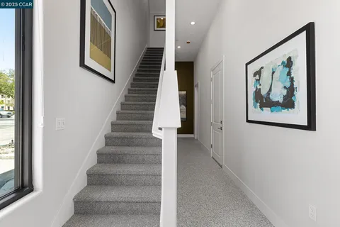 a view of an entryway with wooden floor and stairs