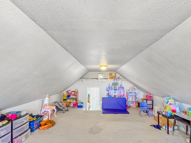 1716 Sagewood Road Price, UT 84501 - Photo 29 of 73 Game room with a textured ceiling and carpet flooring
