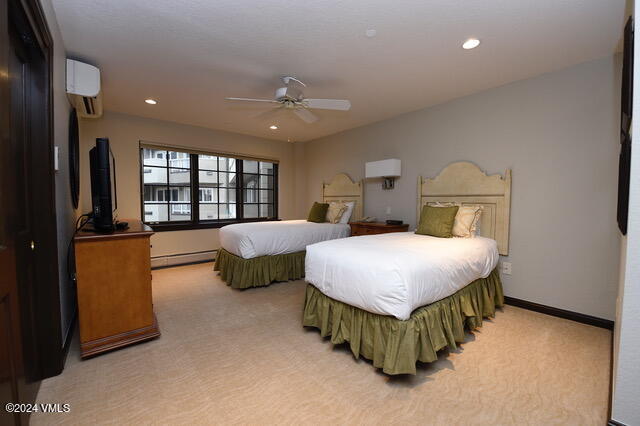 210 Offerson Road, Unit R41026 Beaver Creek, CO 81620 - Photo 9 of 23 a spacious bedroom with a bed and a couch