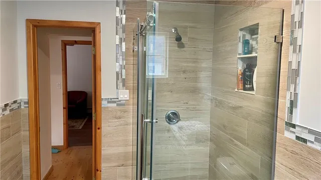 a view of a hallway with dining area