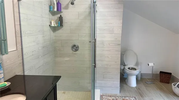 a bathroom with a granite countertop sink a vanity and a mirror