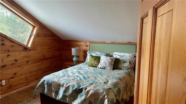 a view of a lush green forest with a lake view