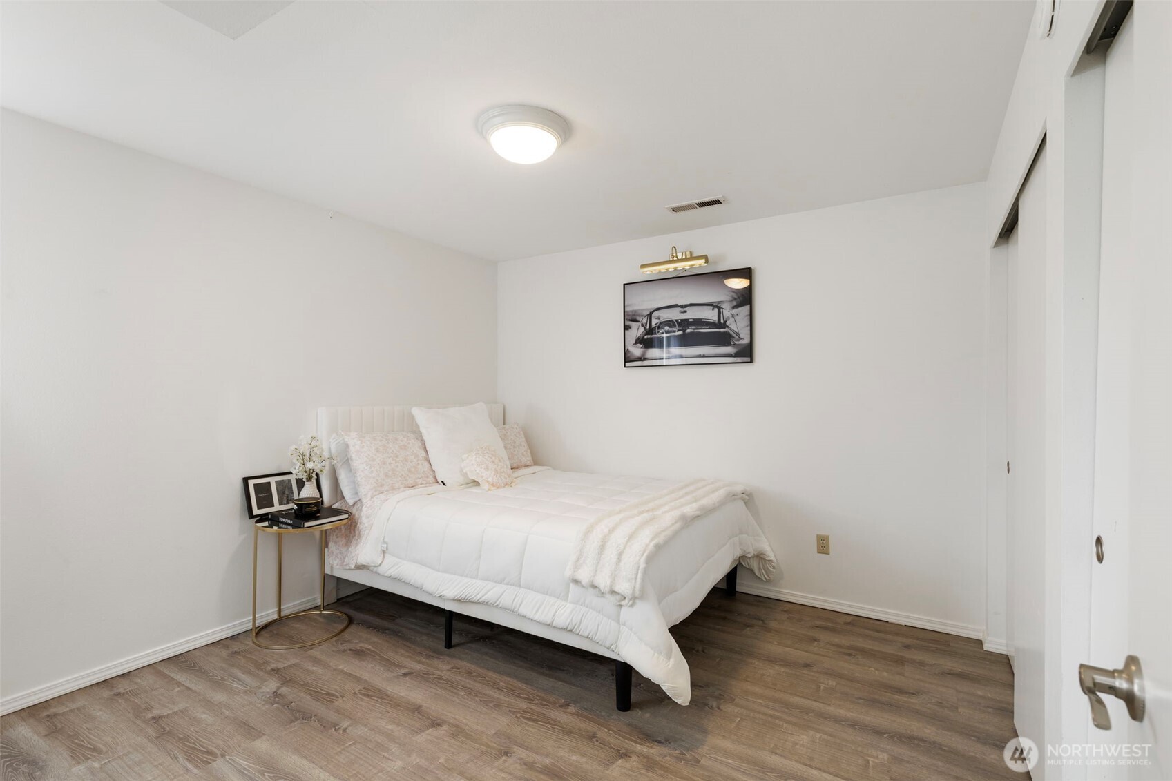 14110 Glenwood Road Southwest Port Orchard, WA 98367 - Photo 24 of 40 a bedroom with a bed and a wall painting