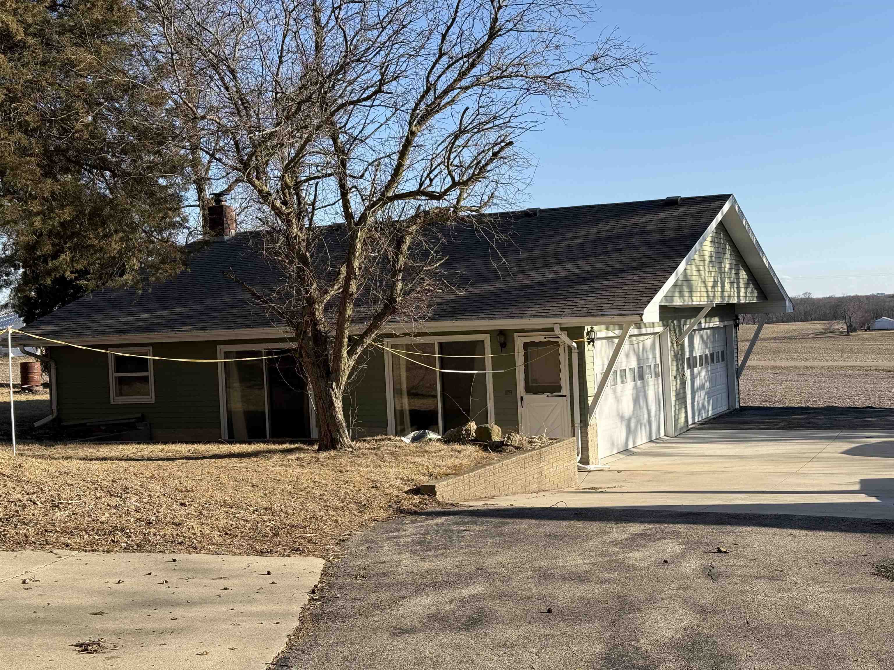 629 North Dakota Road Ridott, IL 61067 - Photo 3 of 26 a front view of a house with a yard and garage