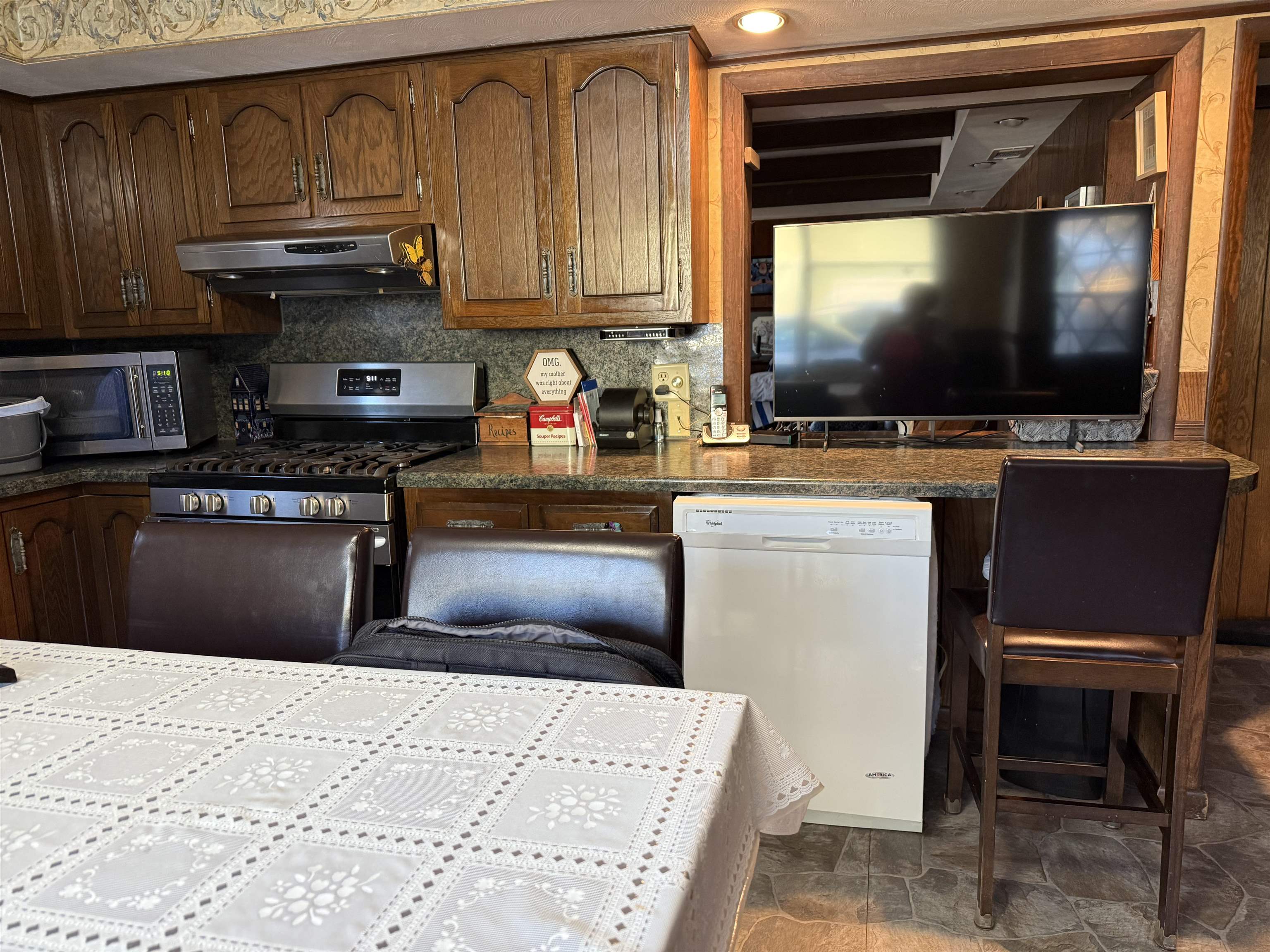 629 North Dakota Road Ridott, IL 61067 - Photo 8 of 26 a kitchen with stainless steel appliances a stove microwave and cabinets