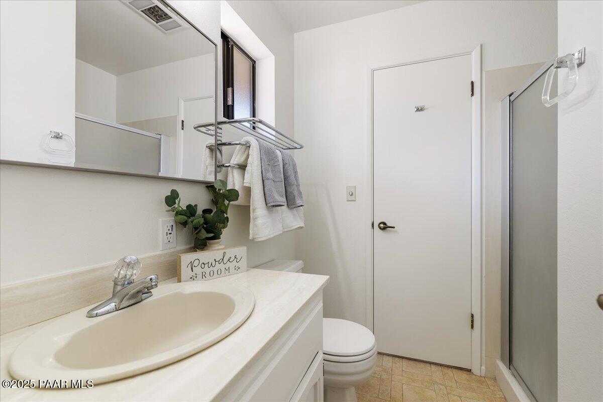 1271 Tanglewood Road Prescott, AZ 86303 - Photo 13 of 18 a bathroom with a sink toilet and shower