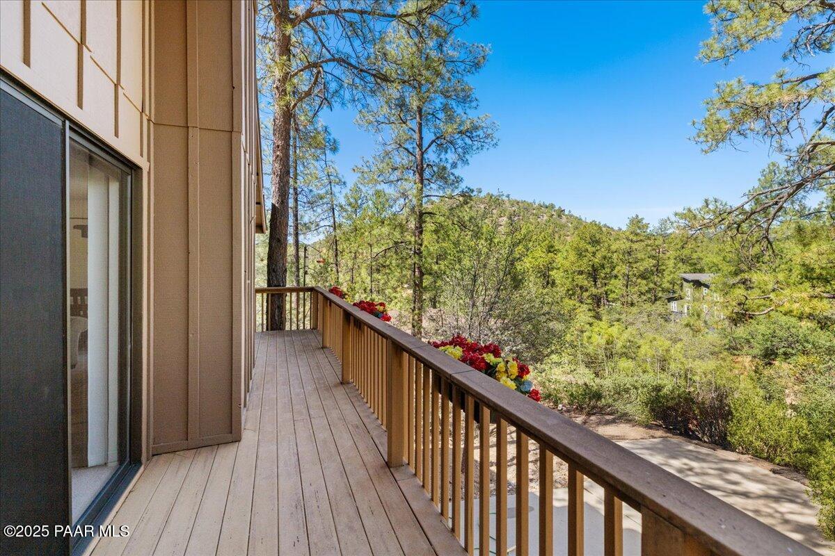 1271 Tanglewood Road Prescott, AZ 86303 - Photo 15 of 18 a view of a balcony with wooden floor and stairs