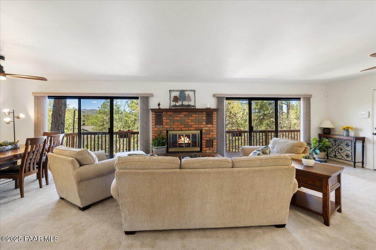 1271 Tanglewood Road Prescott, AZ 86303 - Photo 3 of 18 a living room with fireplace furniture and a large window