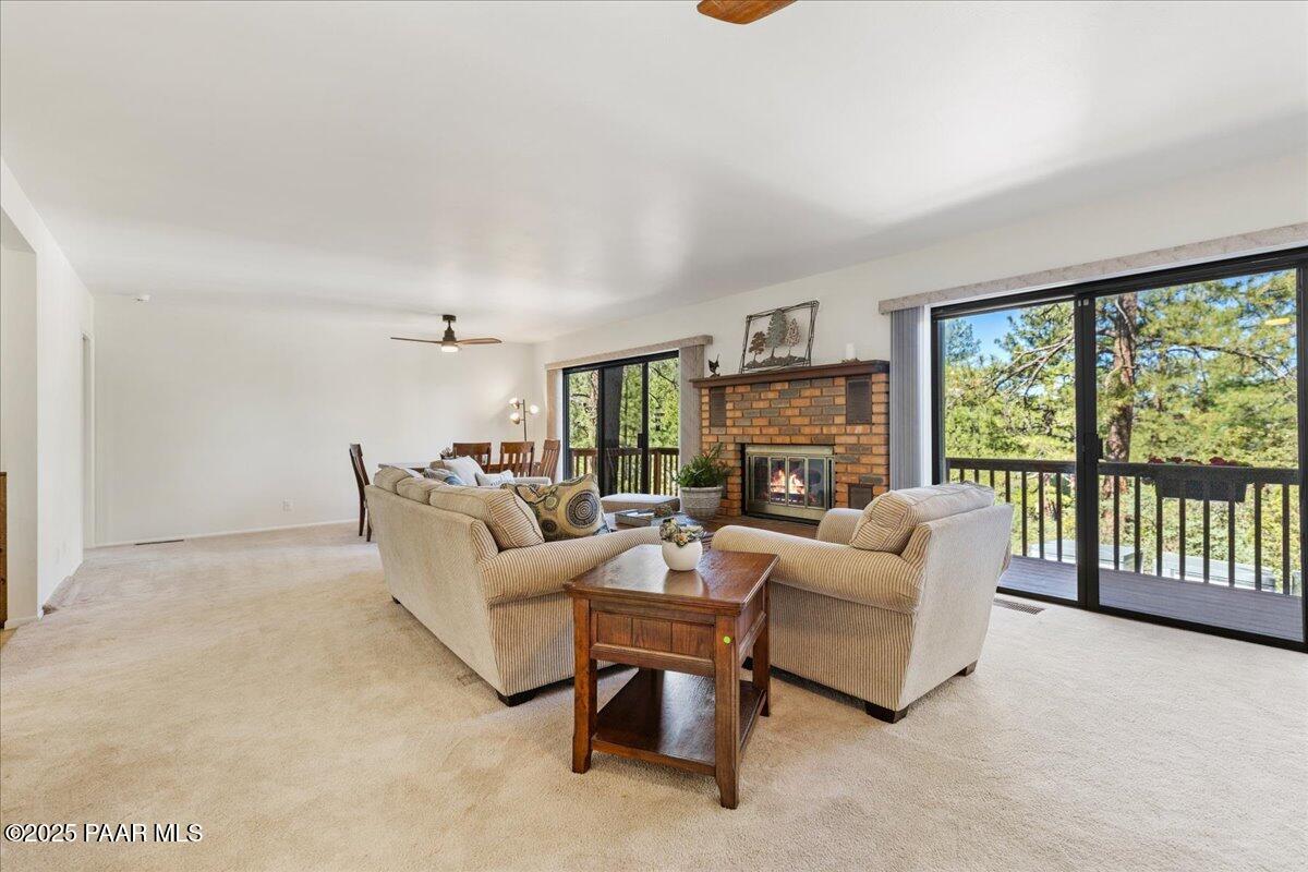 1271 Tanglewood Road Prescott, AZ 86303 - Photo 4 of 18 a living room with furniture and a fireplace