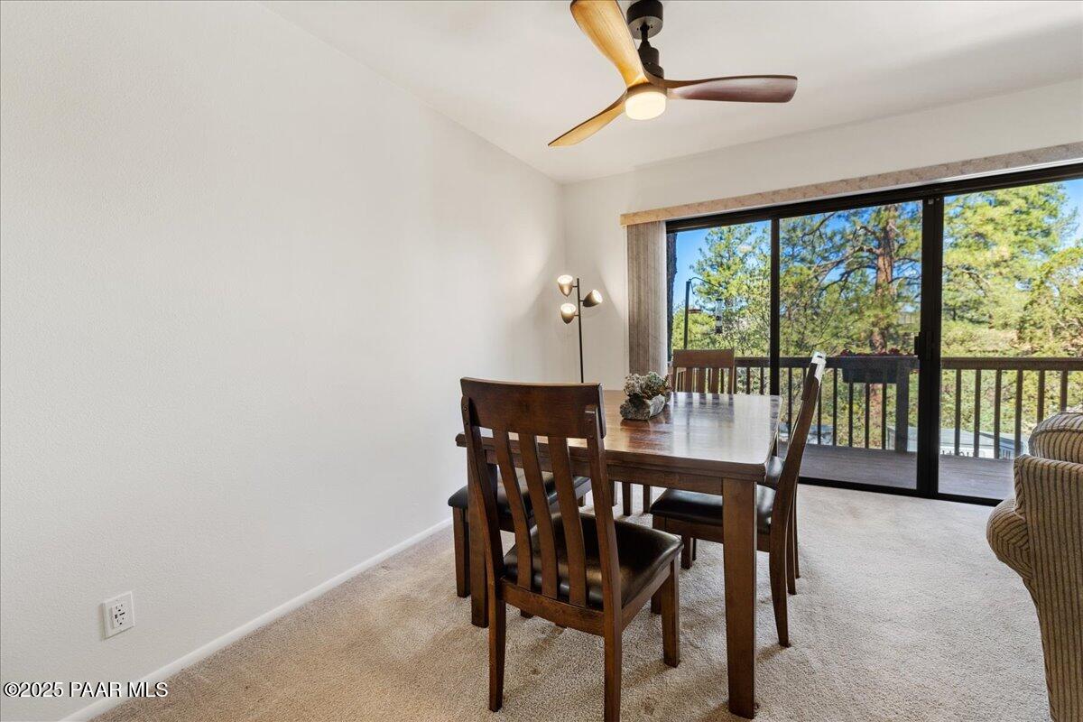 1271 Tanglewood Road Prescott, AZ 86303 - Photo 5 of 18 a view of a dining room with furniture window and outside view