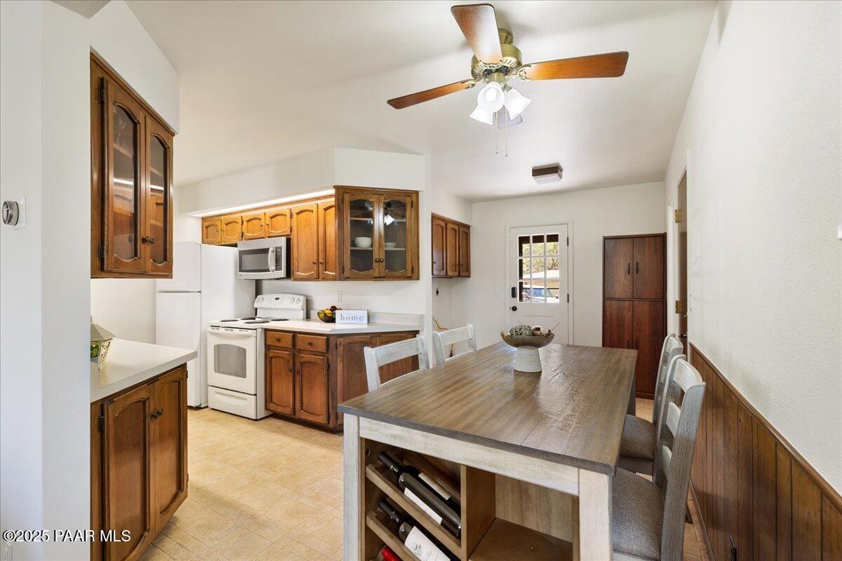 1271 Tanglewood Road Prescott, AZ 86303 - Photo 6 of 18 a kitchen with a table chairs stove and refrigerator