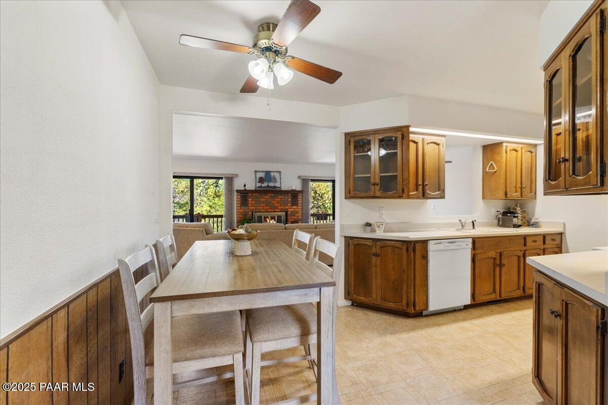 1271 Tanglewood Road Prescott, AZ 86303 - Photo 7 of 18 a kitchen with kitchen island granite countertop lots of counter top space and stainless steel appliances
