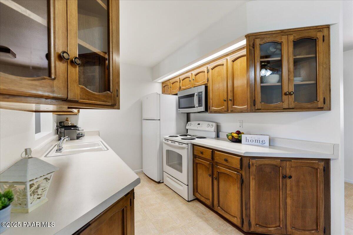 1271 Tanglewood Road Prescott, AZ 86303 - Photo 8 of 18 a kitchen with a sink stove and microwave