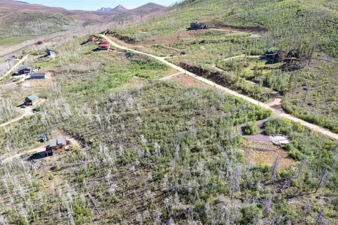 an aerial view of residential house with an outdoor space