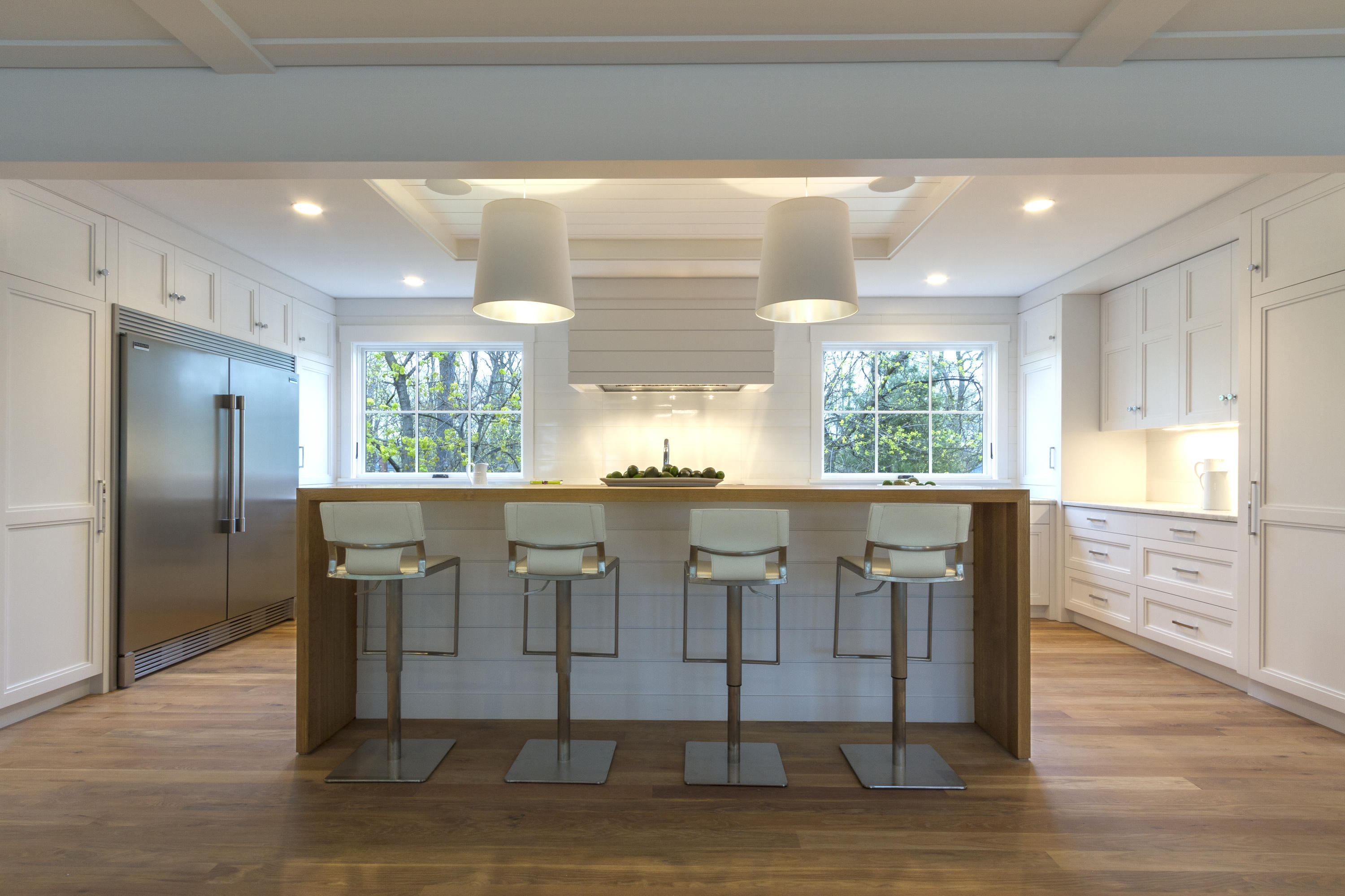 14 Clocks Lane Darien, CT 06820 - Photo 11 of 46 a view of cabinets and dining table with wooden floor