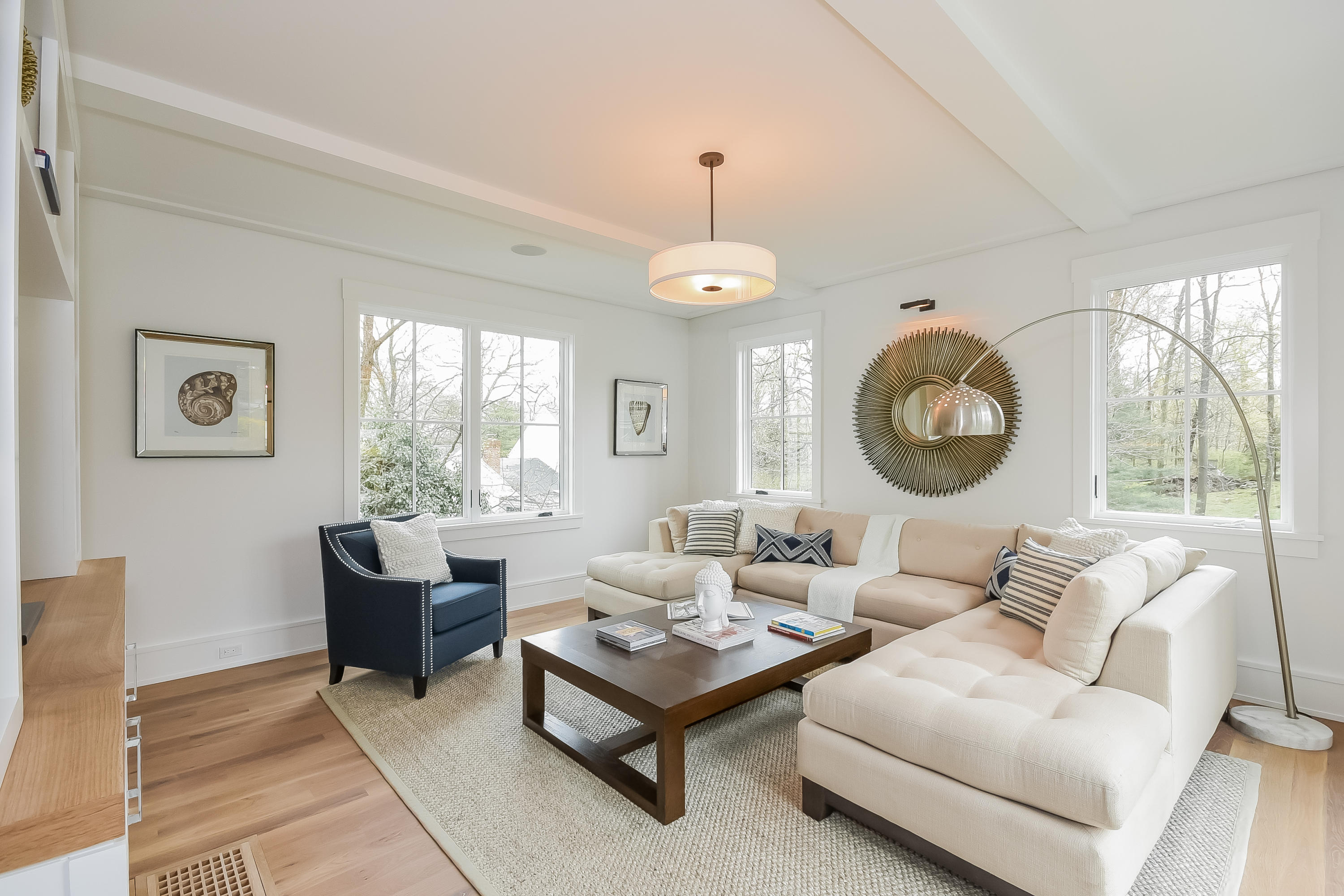 14 Clocks Lane Darien, CT 06820 - Photo 17 of 46 a living room with furniture chandelier and a large window
