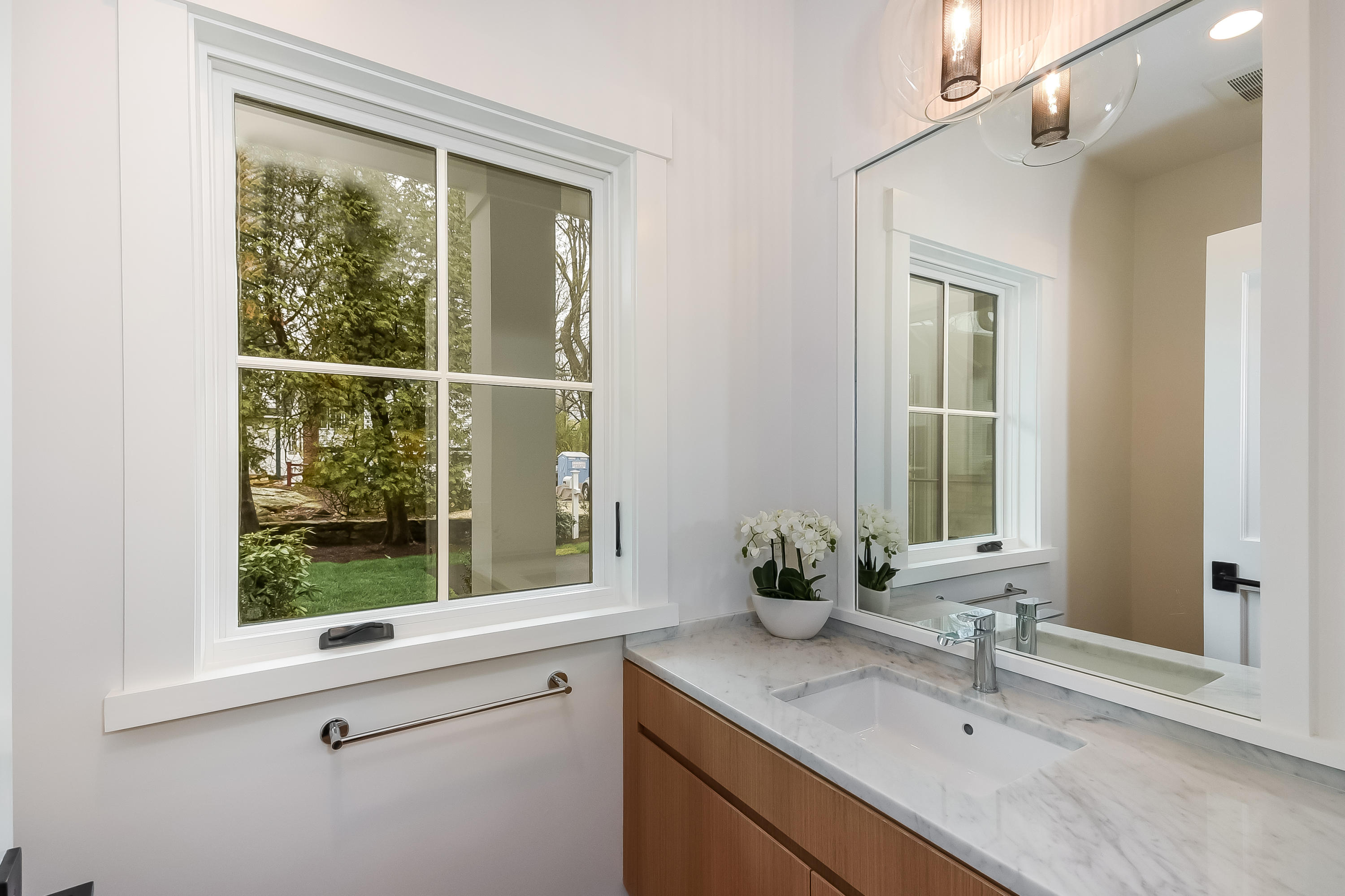 14 Clocks Lane Darien, CT 06820 - Photo 20 of 46 a bathroom with a granite countertop sink mirror and window