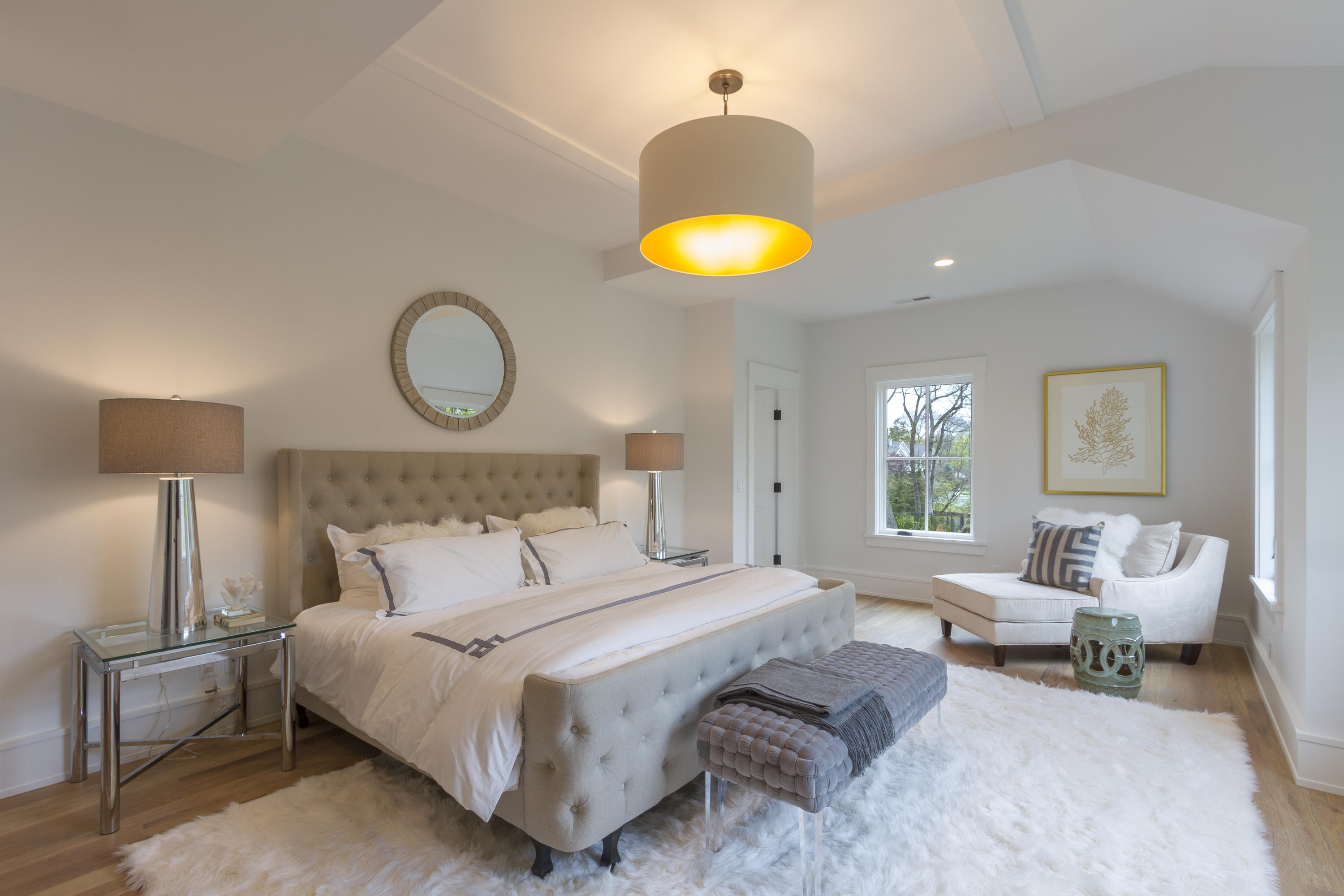 14 Clocks Lane Darien, CT 06820 - Photo 24 of 46 a bedroom with a bed and a chandelier