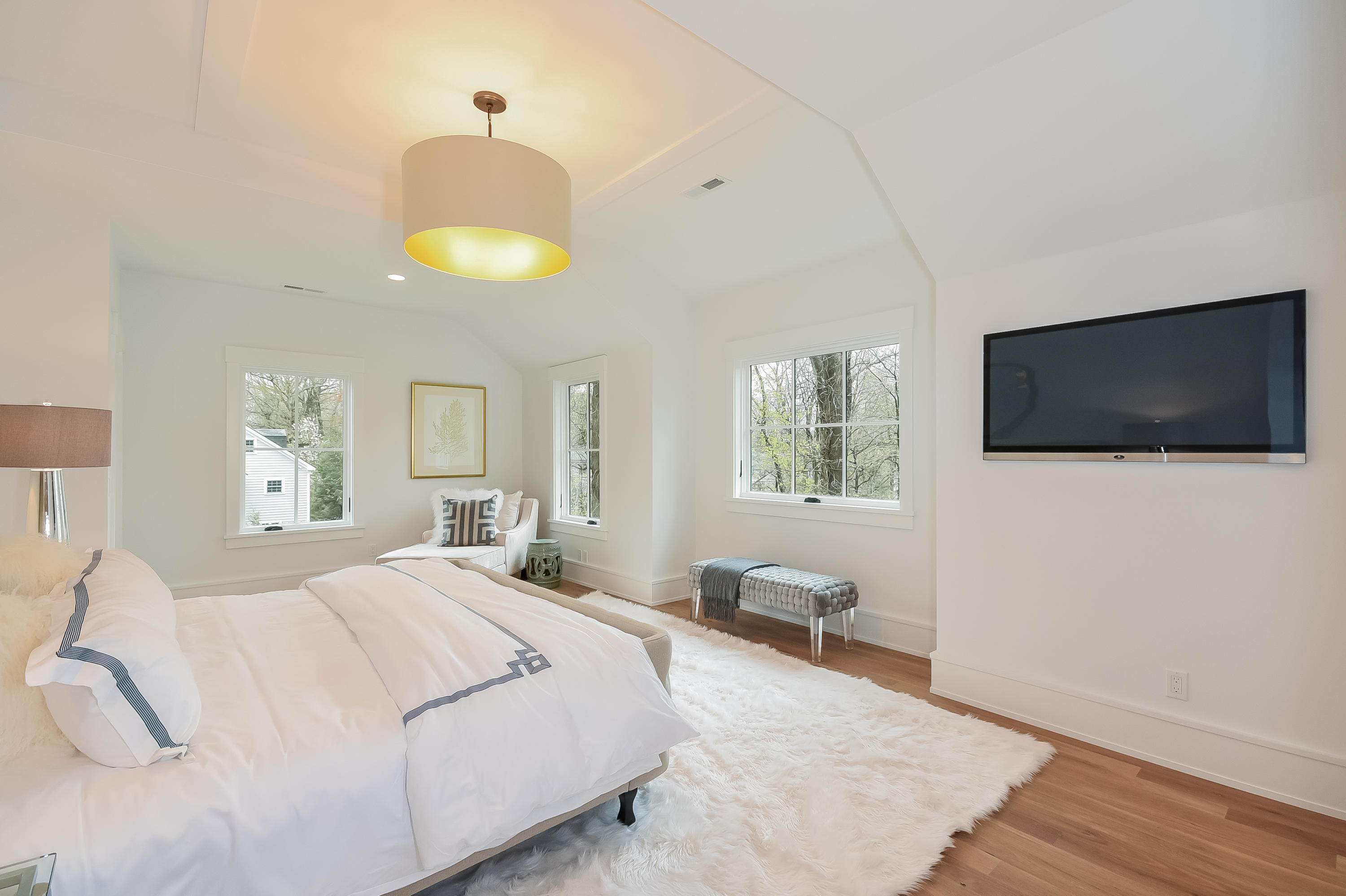 14 Clocks Lane Darien, CT 06820 - Photo 25 of 46 a bedroom with a bed and a flat screen tv
