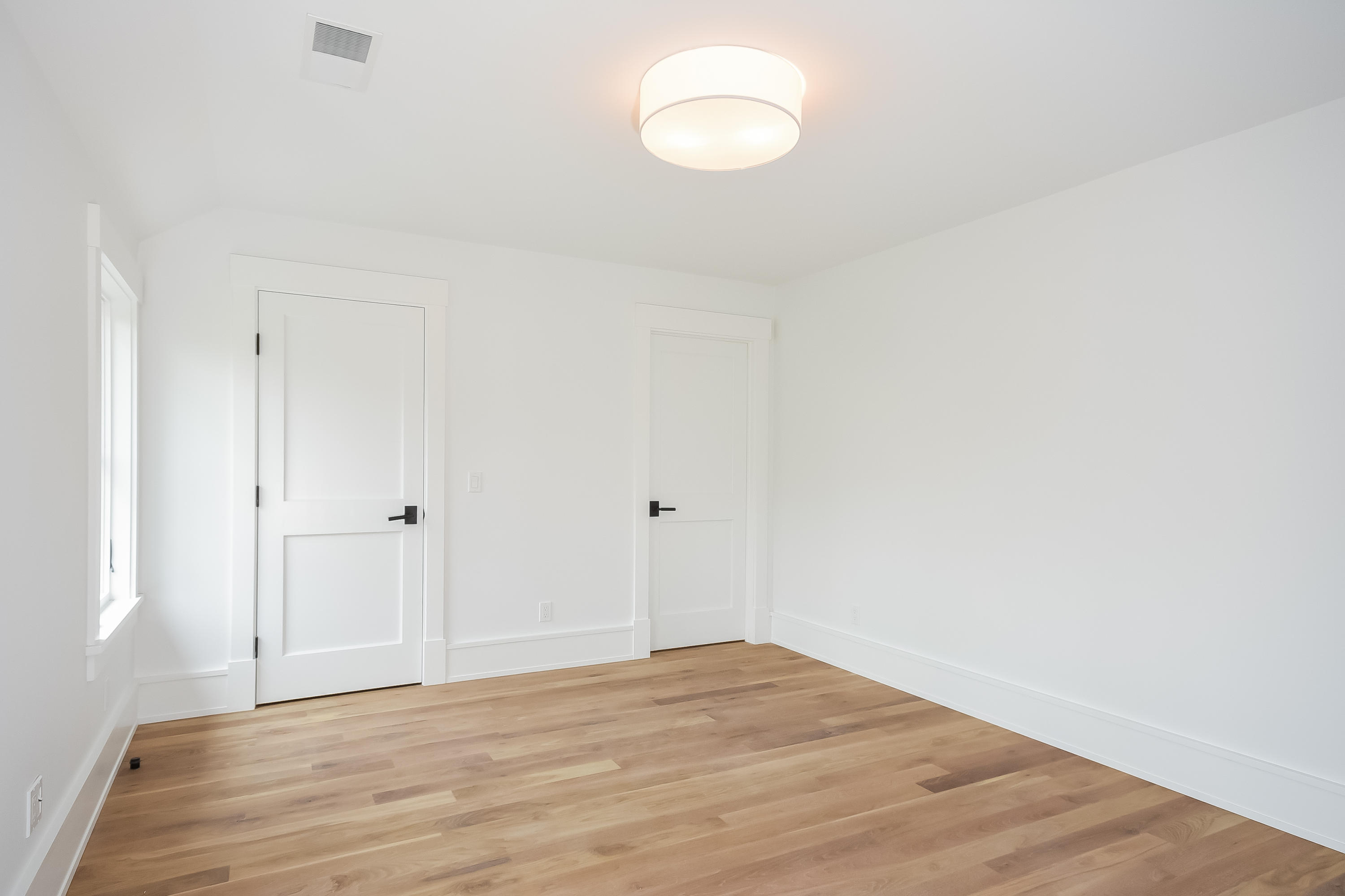 14 Clocks Lane Darien, CT 06820 - Photo 31 of 46 a view of a room with wooden floor and white walls