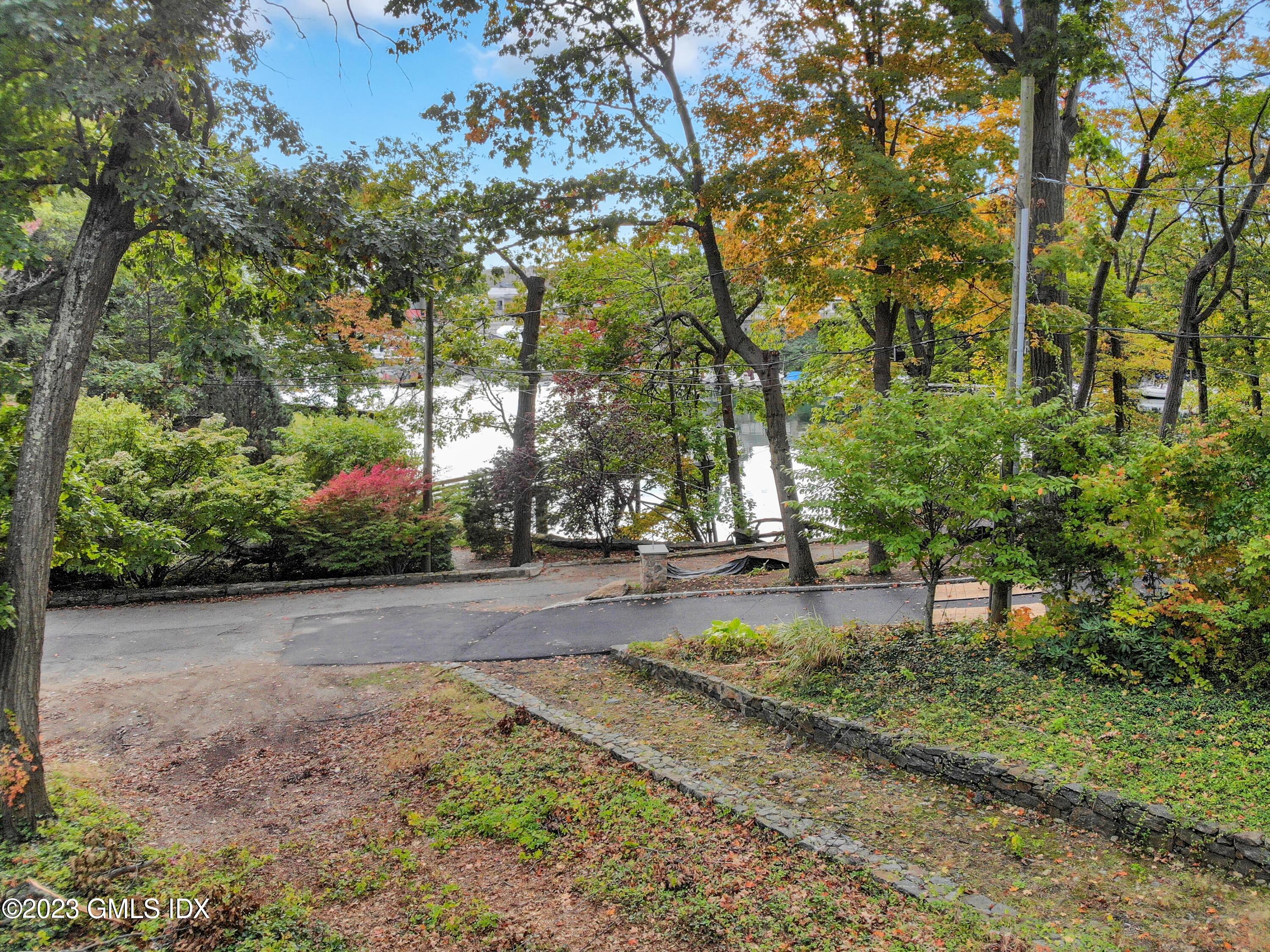 180 Byram Shore Road Greenwich, CT 06830 - Photo 15 of 29 a view of a street with a tree