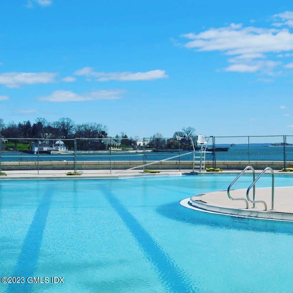 180 Byram Shore Road Greenwich, CT 06830 - Photo 24 of 29 a view of swimming pool with seating space and hardwood floor