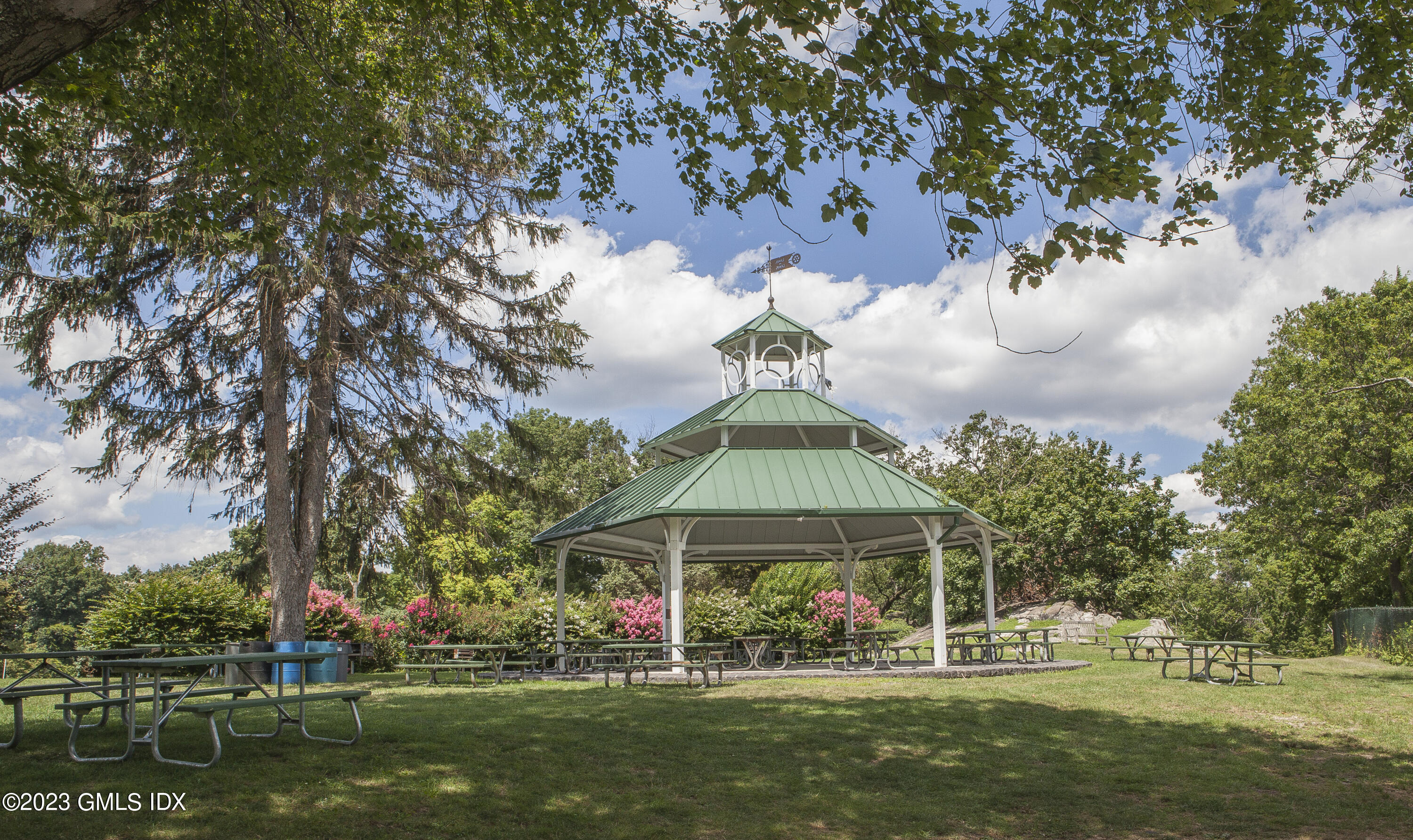 180 Byram Shore Road Greenwich, CT 06830 - Photo 25 of 29 a front view of a house with a yard